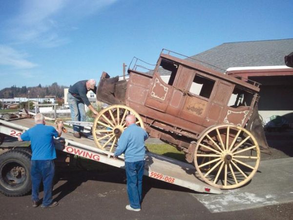 Jerry & Cec donate another carriage, this stagecoach, given to the Museum they inspired building. PHOTO: Chinook Observer